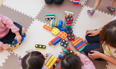 Children playing with colourful blocks